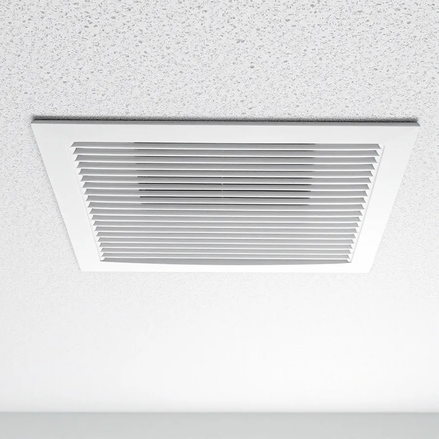 White ceiling supply air register with metal louvers set into a plain painted ceiling, seen from below