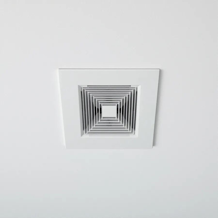 Looking up at a white ceiling with a square flush panel set into it, concentric square louvres at its centre